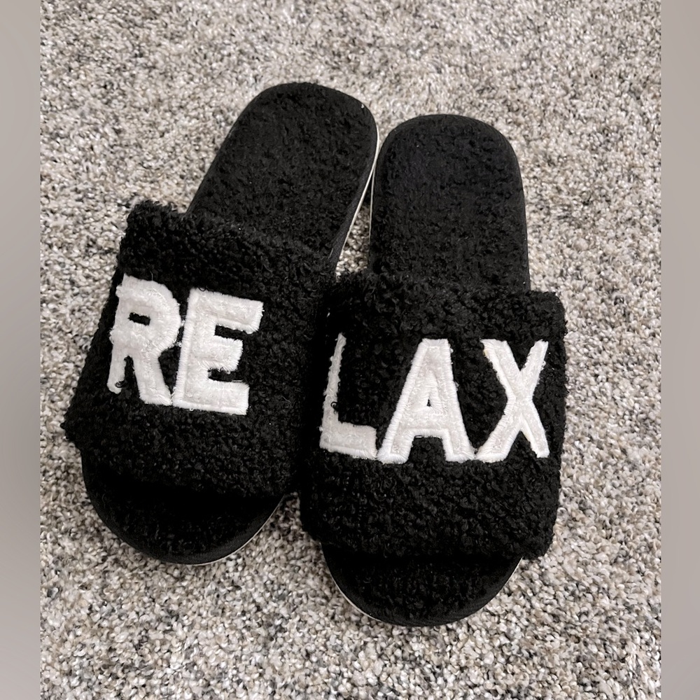 Black women’s slide slippers.  L/XL